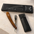 TVP Heritage walnut shavette razor with storage pouch and TVP box on a marble surface